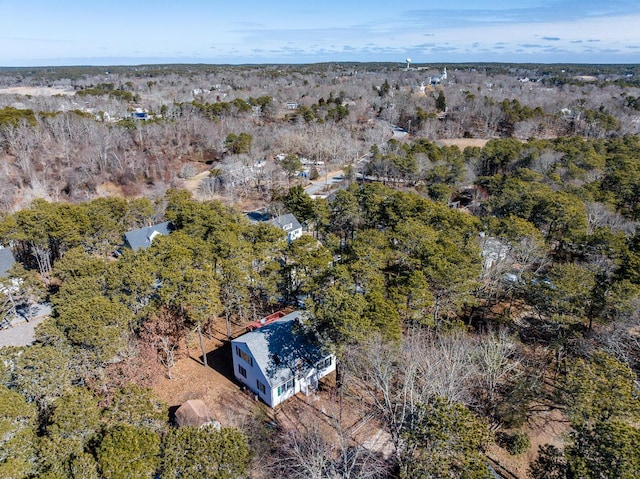 drone / aerial view featuring a view of trees