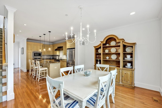 780 Craigville Beach Rd Unit 10, Centerville, MA 02632 - dining room with stairs, light wood-type flooring, crown molding, a chandelier, and recessed lighting