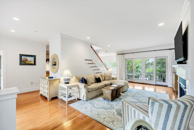 780 Craigville Beach Rd Unit 10, Centerville, MA 02632 - living area with light wood-style flooring, crown molding, stairs, recessed lighting, and a fireplace