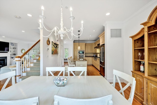 780 Craigville Beach Rd Unit 10, Centerville, MA 02632 - dining space with recessed lighting, a chandelier, light wood-style floors, ornamental molding, and stairway