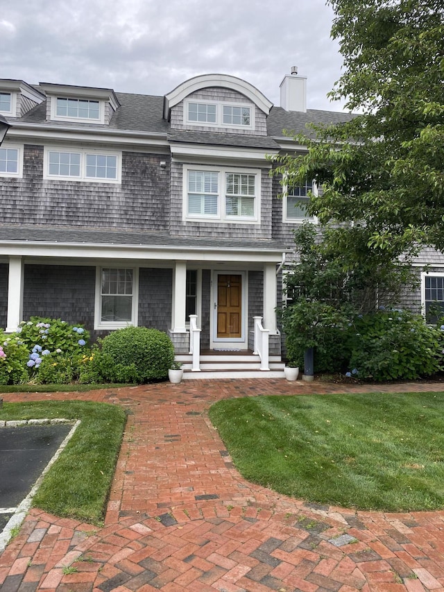 780 Craigville Beach Rd Unit 10, Centerville, MA 02632 - shingle-style home with a chimney and covered porch