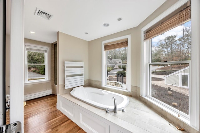 86 Summersea Rd, Mashpee, MA 02649 - bathroom featuring recessed lighting, wood finished floors, a baseboard heating unit, visible vents, and a garden tub