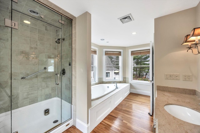 86 Summersea Rd, Mashpee, MA 02649 - full bath with wood finished floors, a sink, visible vents, a stall shower, and a garden tub