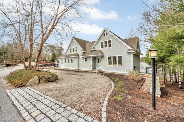 86 Summersea Rd, Mashpee, MA 02649 - view of front facade featuring fence, roof with shingles, and gravel driveway