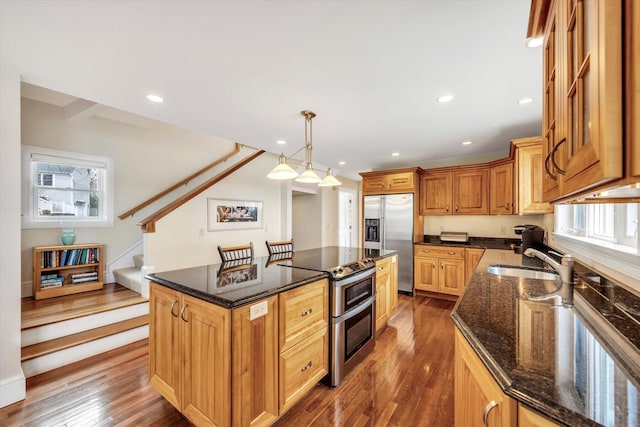 86 Summersea Rd, Mashpee, MA 02649 - kitchen featuring dark stone counters, a sink, appliances with stainless steel finishes, and dark wood-type flooring