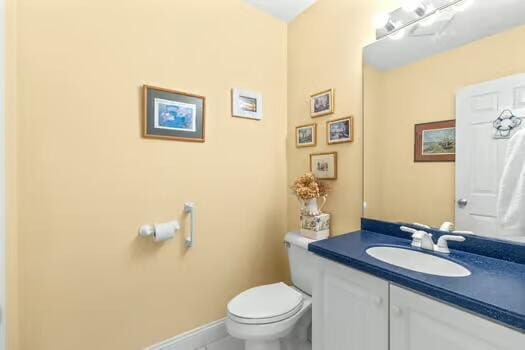 3 Mayfair Ct, Mashpee, MA 02649 - half bathroom featuring vanity and tile patterned flooring