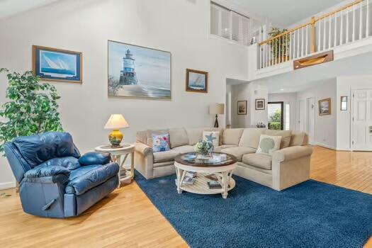 3 Mayfair Ct, Mashpee, MA 02649 - living room with wood finished floors and a high ceiling