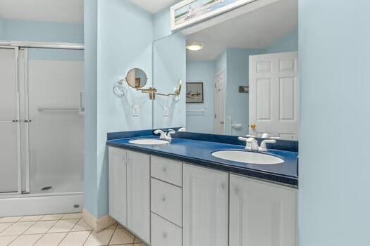 3 Mayfair Ct, Mashpee, MA 02649 - bathroom featuring a shower stall, double vanity, and tile patterned floors