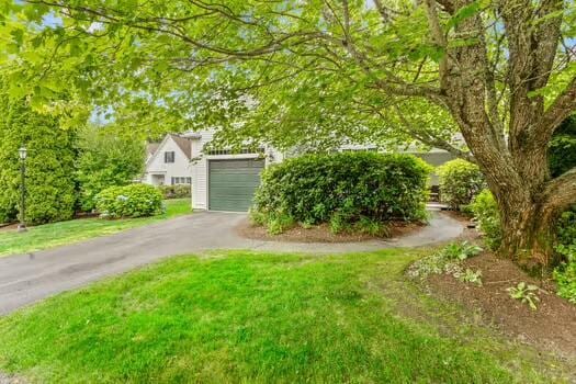 3 Mayfair Ct, Mashpee, MA 02649 - view of front facade featuring asphalt driveway and a garage