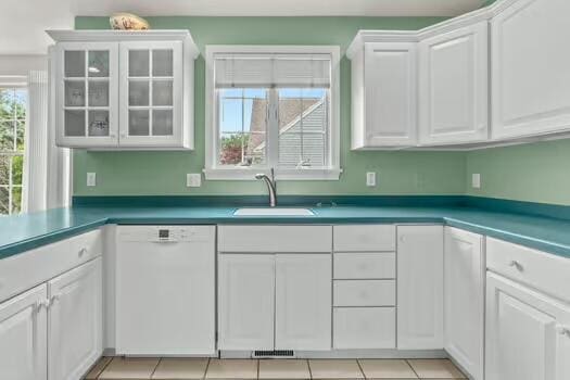 3 Mayfair Ct, Mashpee, MA 02649 - kitchen featuring white dishwasher, white cabinets, and glass insert cabinets