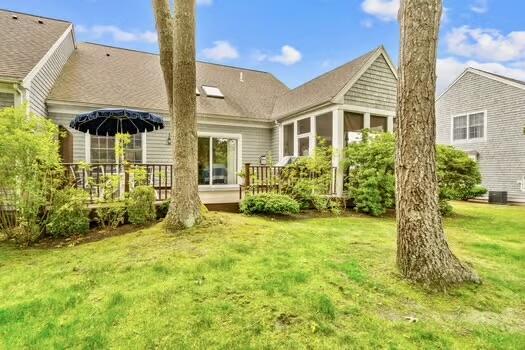 3 Mayfair Ct, Mashpee, MA 02649 - rear view of house featuring a wooden deck and a yard