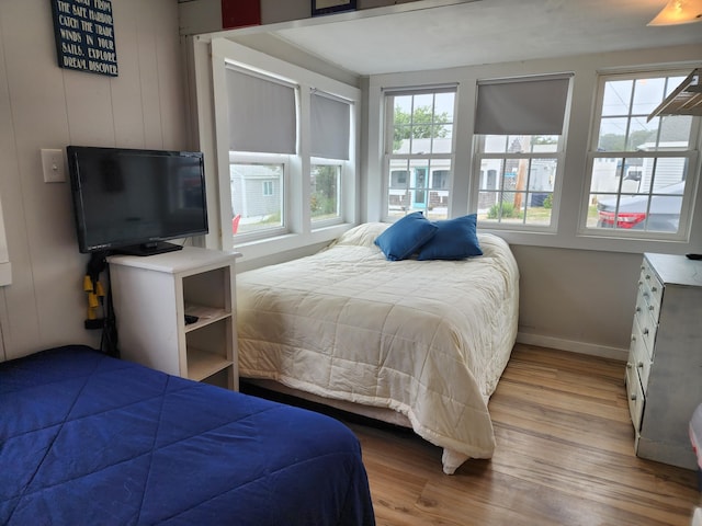 bedroom with hardwood / wood-style floors