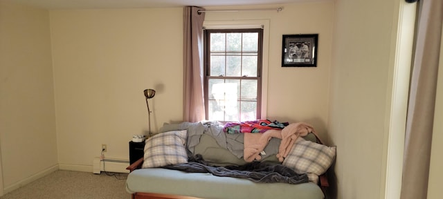 bedroom featuring light carpet and a baseboard radiator