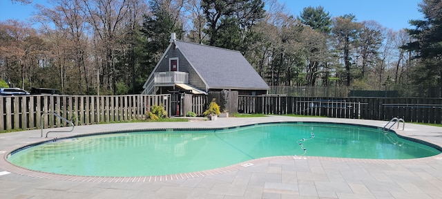 view of swimming pool with a patio