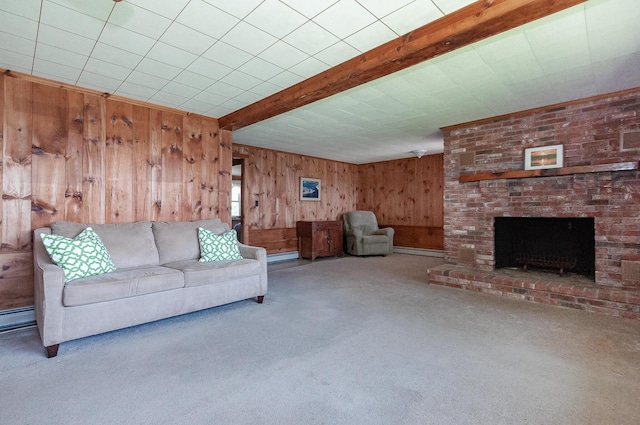 unfurnished living room with a brick fireplace, baseboard heating, carpet, and beam ceiling