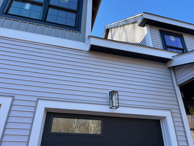 view of home's exterior featuring a garage and board and batten siding