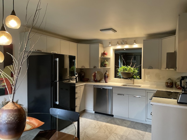104 Chestnut Cir, Brewster, MA 02631 - kitchen with stainless steel dishwasher, freestanding refrigerator, light countertops, light marble finish flooring, and open shelves