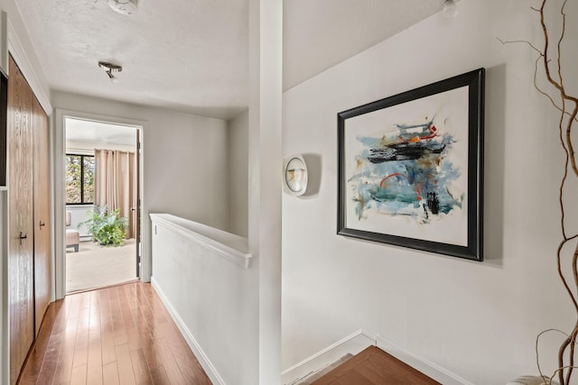 104 Chestnut Cir, Brewster, MA 02631 - corridor featuring wood finished floors and an upstairs landing