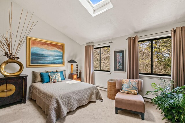 104 Chestnut Cir, Brewster, MA 02631 - carpeted bedroom with a skylight, vaulted ceiling, and baseboard heating