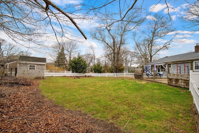 view of yard with a fenced backyard, a patio area, and an outdoor structure