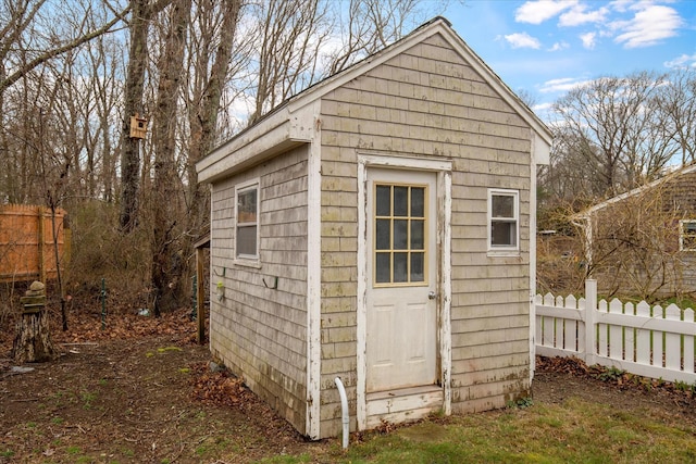 view of shed with fence