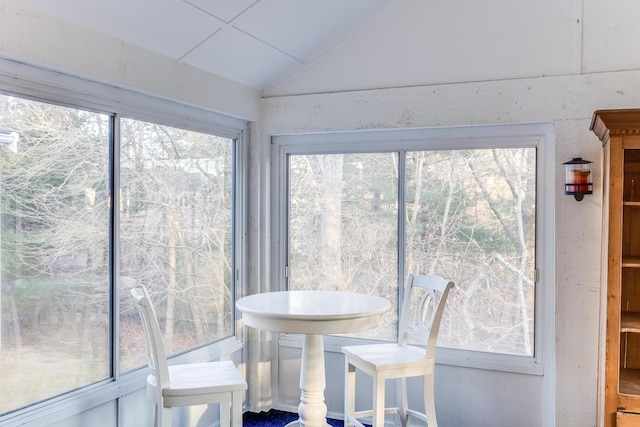 sunroom with lofted ceiling and plenty of natural light