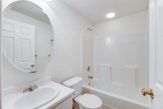 bathroom featuring vanity, toilet, and tub / shower combination