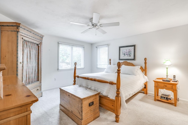 bedroom featuring ceiling fan and light colored carpet