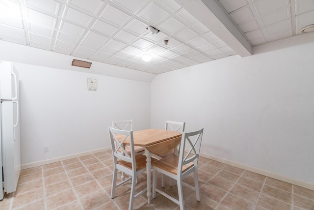 dining area with light tile patterned flooring