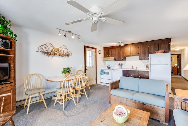 carpeted living room with a baseboard heating unit, sink, and ceiling fan