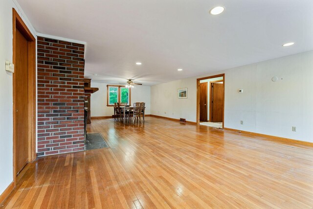 7 Bittersweet Ln, South Dennis, MA 02660 - living room featuring baseboards, a brick fireplace, and wood finished floors