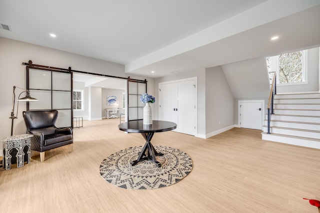 179 Beebe Acres Rd, Falmouth, MA 02540 - interior space featuring a barn door, baseboards, visible vents, and light wood-style flooring