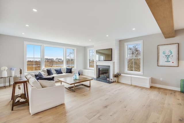 179 Beebe Acres Rd, Falmouth, MA 02540 - living room with recessed lighting, a fireplace with flush hearth, light wood finished floors, and baseboards