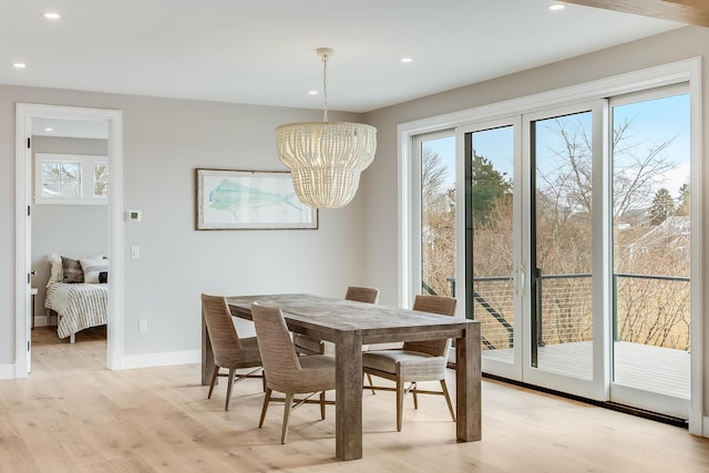 179 Beebe Acres Rd, Falmouth, MA 02540 - dining space featuring light wood-style floors, a wealth of natural light, and a notable chandelier