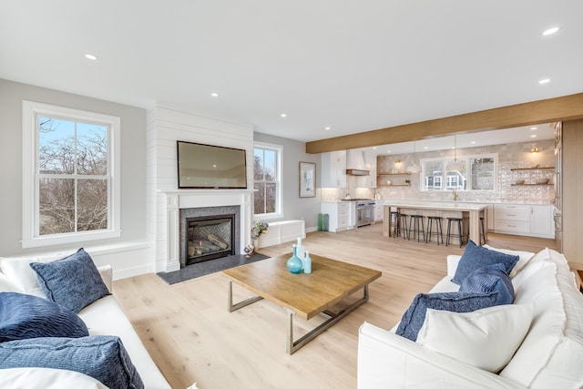 179 Beebe Acres Rd, Falmouth, MA 02540 - living room with recessed lighting, a high end fireplace, light wood finished floors, and baseboards