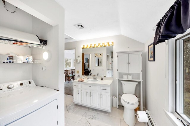 11 Elizabeth Ln, West Yarmouth, MA 02673 - bathroom featuring washer / clothes dryer, vanity, toilet, marble finish floor, and lofted ceiling