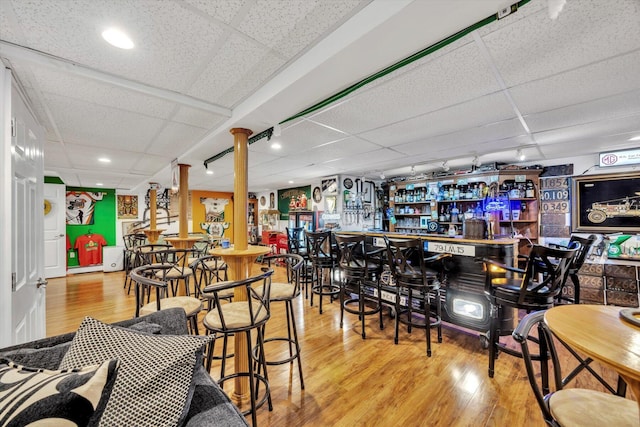 11 Elizabeth Ln, West Yarmouth, MA 02673 - bar with a bar, a paneled ceiling, wood finished floors, and recessed lighting