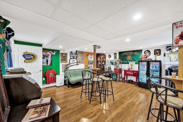 11 Elizabeth Ln, West Yarmouth, MA 02673 - bar with baseboard heating, a drop ceiling, and light wood-style flooring