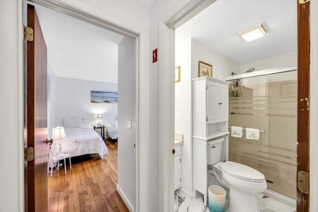 11 Elizabeth Ln, West Yarmouth, MA 02673 - ensuite bathroom featuring toilet, ensuite bath, baseboards, and a stall shower