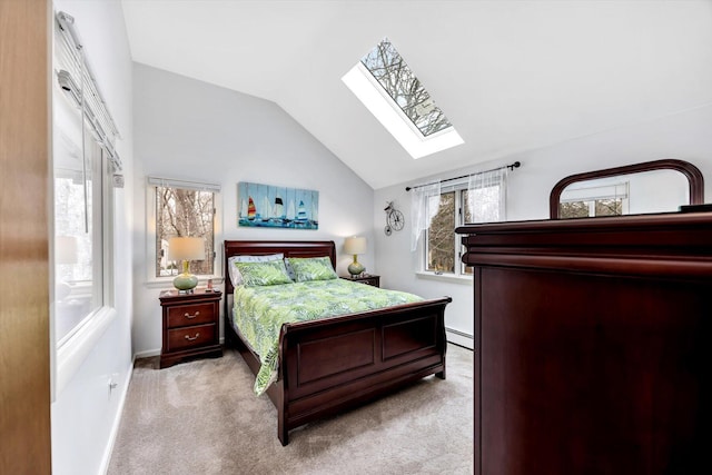 11 Elizabeth Ln, West Yarmouth, MA 02673 - carpeted bedroom with vaulted ceiling with skylight, baseboard heating, and baseboards