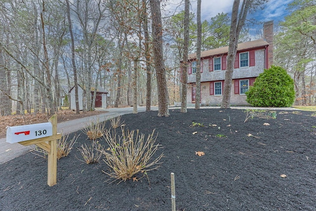 130 Surrey Ln, Brewster, MA 02631 - view of front of property with a chimney and an outbuilding