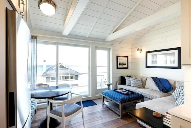 interior space featuring wood ceiling, vaulted ceiling with beams, plenty of natural light, and wood-type flooring