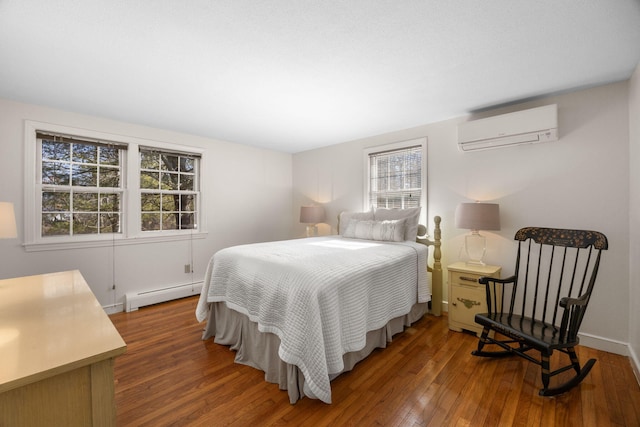 bedroom with an AC wall unit, dark wood-type flooring, and a baseboard radiator