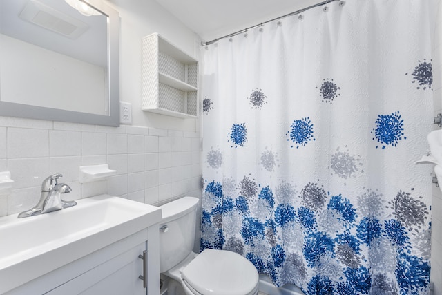 full bathroom featuring toilet, vanity, tile walls, and a shower with shower curtain