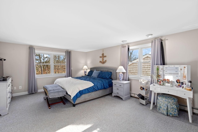 bedroom featuring a baseboard radiator, light carpet, and baseboards