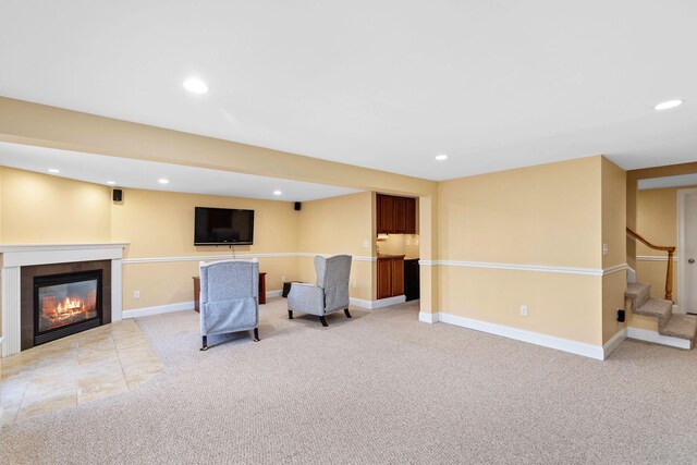 living area with carpet floors, recessed lighting, built in features, and baseboards