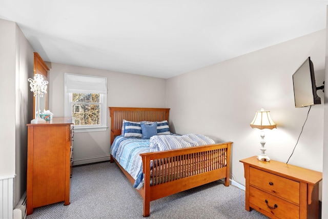 bedroom with carpet floors, baseboards, a baseboard heating unit, and baseboard heating