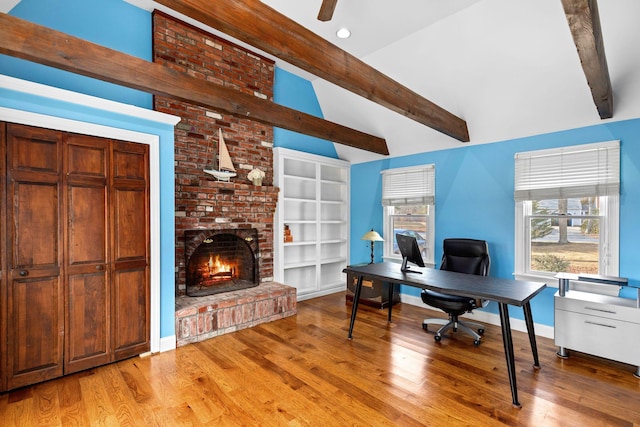 office featuring ceiling fan, recessed lighting, a fireplace, wood finished floors, and baseboards