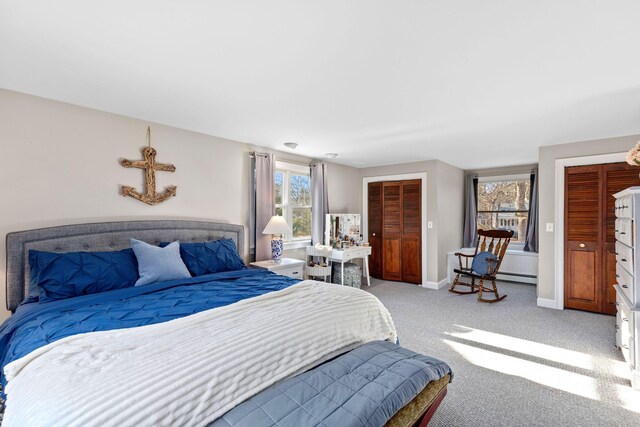 bedroom featuring baseboards and light colored carpet