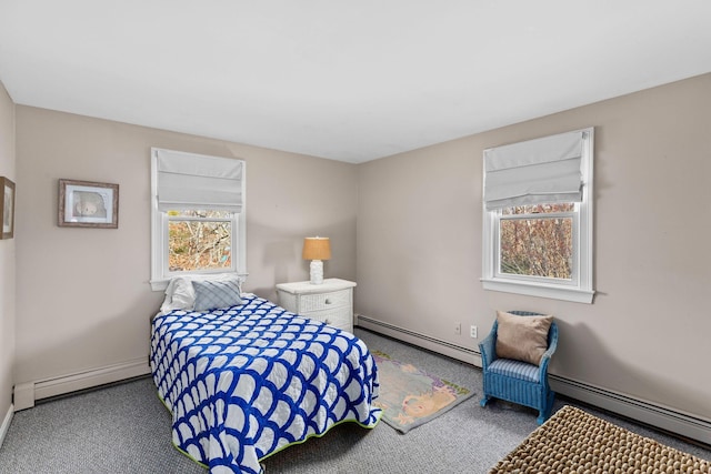 bedroom featuring carpet floors, a baseboard radiator, a baseboard heating unit, and baseboards